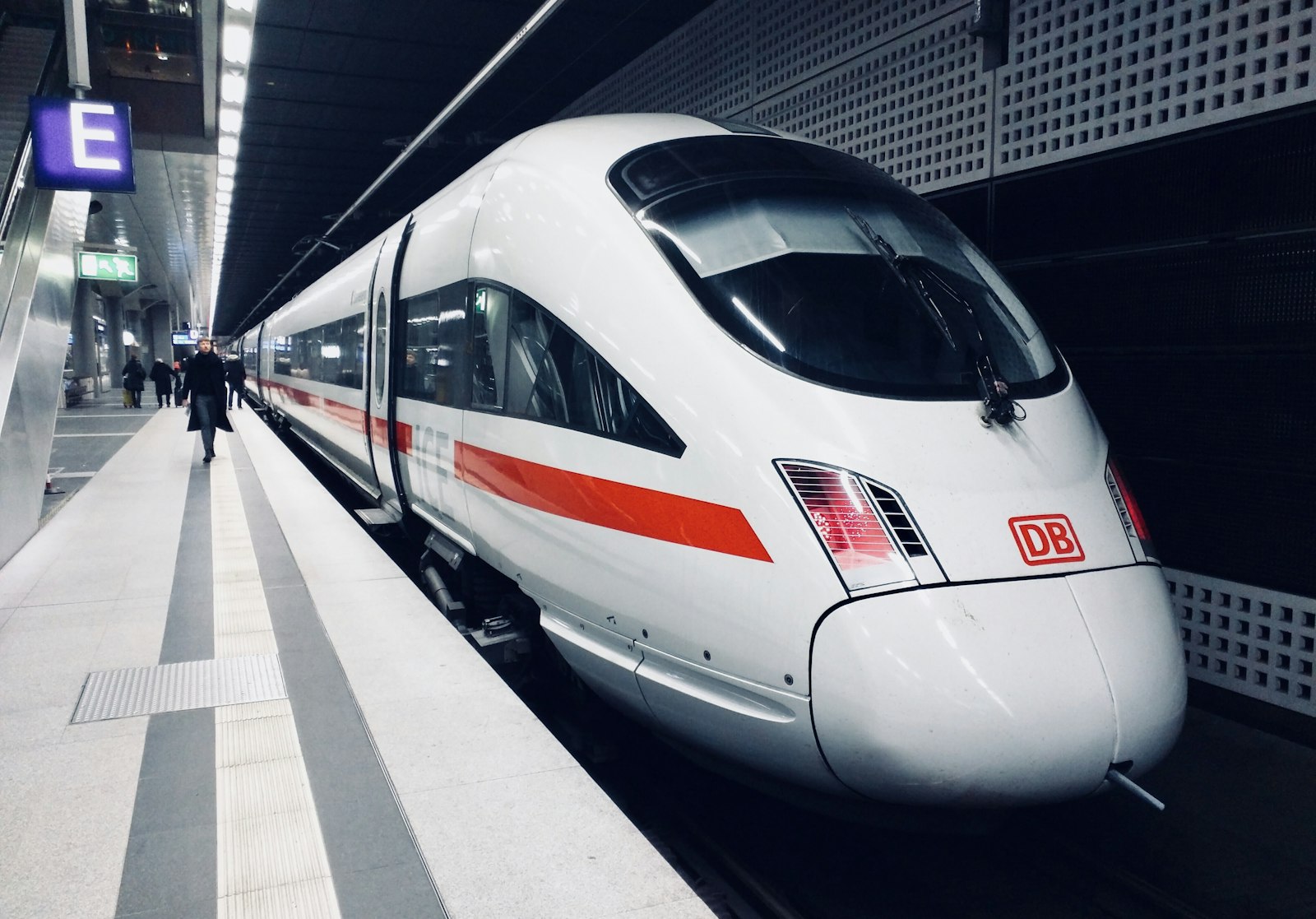 White high-speed electric train at a modern station platform